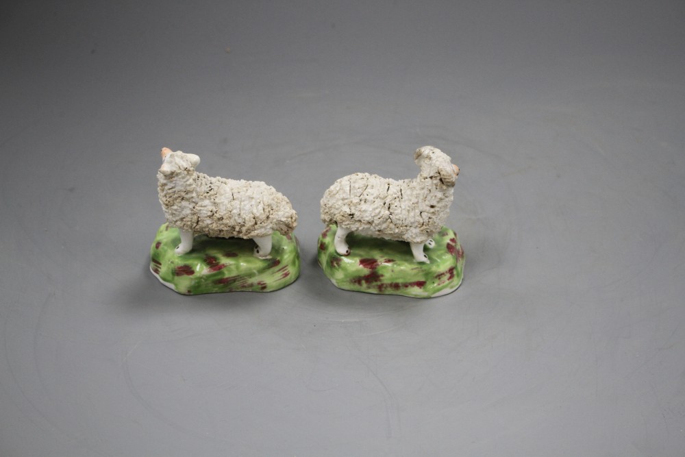 A pair of Staffordshire porcelain groups of sheep and lambs, c.1840-50, L. 7.4cm